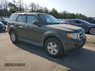 2011 Ford Escape Hybrid with VIN 1FMCU4K35BKA16469, listed as a Copart auction lot 65811905 with 401,583 mi miles and Clean title. Bid and sale history available at DreamBid. Image 4.