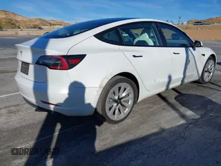 2023 Tesla Model 3 with VIN 5YJ3E1EAXPF486639, listed as a IAAI auction lot 41387797 with 18,603 mi miles and . Bid and sale history available at carsss.com. Image 4.