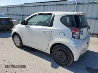 2012 Scion iQ with VIN JTNJJXB06CJ019475, listed as a Copart auction lot 61358615 with 94,194 mi miles and Clean title. Bid and sale history available at DreamBid. Image 2.