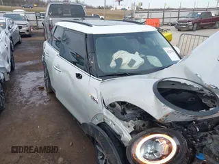 2019 MINI Hardtop 4 Door Cooper S with VIN WMWXU3C59K2H87159, listed as a IAAI auction lot 41225965 with 76,640 mi miles and . Bid and sale history available at DreamBid. Image 1.