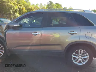 2014 Kia Sorento LX with VIN 5XYKTCA63EG506217, listed as a IAAI auction lot 42050413 with 126,806 mi miles and . Bid and sale history available at carsss.com. Image 14.