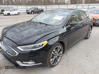 2017 Ford Fusion Titanium z VIN 3FA6P0K98HR200272, wystawiony jako IAAI lot #41905017 z przebiegiem 104 132 mil mil oraz . Historia ofert i sprzedaży dostępna na DreamBid. Obrazek 17.