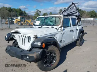 2021 Jeep Wrangler Unlimited Sport S z VIN 1C4HJXDG2MW705126, wystawiony jako IAAI lot #42048244 z przebiegiem 34 317 mil mil oraz . Historia ofert i sprzedaży dostępna na DreamBid. Obrazek 2.