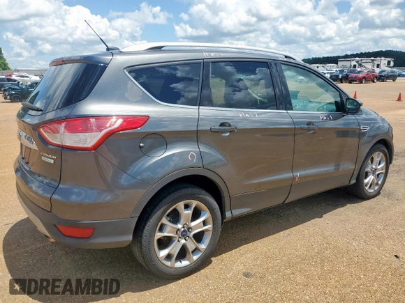 2015 Ford Escape Titanium with VIN 1FMCU0J92FUB80769, listed as a Copart auction lot 61988435 with 103,212 mi miles and Salvage title. Bid and sale history available at DreamBid. Image 3.