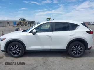 2018 Mazda CX-5 Touring with VIN JM3KFACM3J0381122, listed as a IAAI auction lot 42023838 with 76,121 mi miles. Bid and sale history available at carsss.com. Image 14.