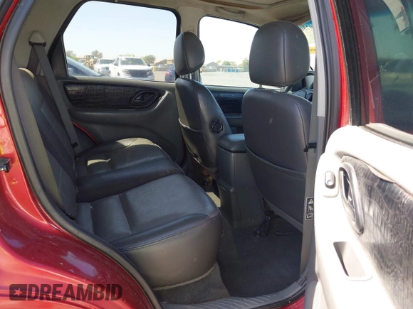 2003 Ford Escape XLT Popular 2 with VIN 1FMYU93123KB02310, listed as a IAAI auction lot 41975073 with 169,864 mi miles. Bid and sale history available at carsss.com. Image 8.