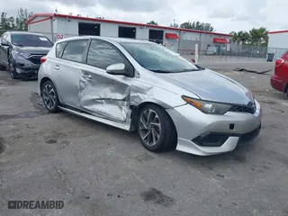 2018 Toyota Corolla iM with VIN JTNKARJE6JJ569706, listed as a IAAI auction lot 41612375 with 214,063 mi miles. Bid and sale history available at carsss.com. Image 1.