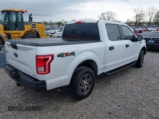 2016 Ford F-150 XLT with VIN 1FTEW1E84GKE18228, listed as a IAAI auction lot 41883297 with 147,018 mi miles. Bid and sale history available at carsss.com. Image 4.