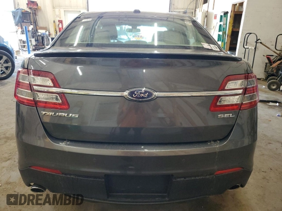 2015 Ford Taurus SEL with VIN 1FAHP2E84FG102318, listed as a Copart auction lot 61744685 with 82,149 mi miles and Salvage title. Bid and sale history available at DreamBid. Image 6.