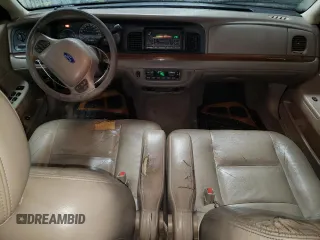 2004 Ford Crown Victoria LX z VIN 2FAFP74W94X171212, wystawiony jako Copart lot #82830214 z przebiegiem 217 595 mil mil oraz Szkody całkowita. Historia ofert i sprzedaży dostępna na DreamBid. Obrazek 8.