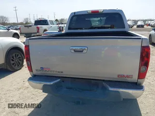 2010 GMC Canyon SLE1 z VIN 1GTJSCDEXA8130361, wystawiony jako IAAI lot #41734671 z przebiegiem 52 621 mil mil oraz . Historia ofert i sprzedaży dostępna na DreamBid. Obrazek 16.