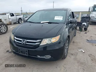 2014 Honda Odyssey Touring with VIN 5FNRL5H9XEB045695, listed as a IAAI auction lot 41545348 with 131,472 mi miles and . Bid and sale history available at carsss.com. Image 2.