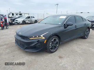 2021 Kia K5 GT-Line z VIN 5XXG64J22MG008335, wystawiony jako IAAI lot #41633257 z przebiegiem 90 534 mil mil oraz . Historia ofert i sprzedaży dostępna na DreamBid. Obrazek 2.