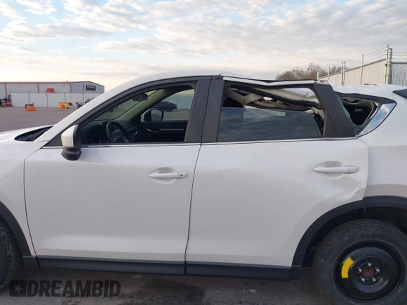 2019 Mazda CX-5 Sport with VIN JM3KFABMXK1655302, listed as a IAAI auction lot 41901293 with 140,369 mi miles and . Bid and sale history available at DreamBid. Image 14.