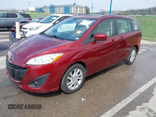 2012 Mazda 5 Sport with VIN JM1CW2BL9C0107471, listed as a IAAI auction lot 42021285 with 104,851 mi miles. Bid and sale history available at carsss.com. Image 2.