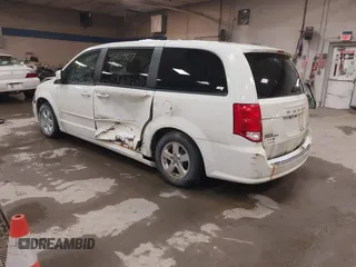 2012 Dodge Grand Caravan SXT with VIN 2C4RDGCG3CR405373, listed as a IAAI auction lot 41264407 with 164,019 mi miles and . Bid and sale history available at DreamBid. Image 3.