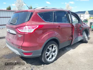 2014 Ford Escape Titanium with VIN 1FMCU9J91EUB53601, listed as a IAAI auction lot 42066465 with 105,933 mi miles and . Bid and sale history available at DreamBid. Image 4.