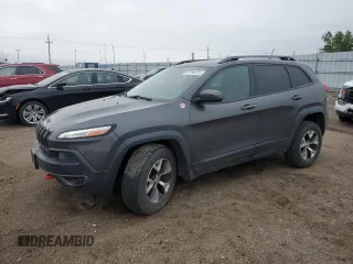 2015 Jeep Cherokee Trailhawk with VIN 1C4PJMBB6FW574108, listed as a Copart auction lot 57798475 with 105,022 mi miles and Salvage title. Bid and sale history available at DreamBid. Image 1.