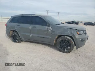 2020 Jeep Grand Cherokee Altitude with VIN 1C4RJFAG5LC105137, listed as a Copart auction lot 48630425 with 104,621 mi miles and Salvage Title. Bid and sale history available at carsss.com. Image 4.