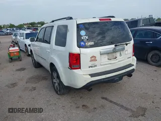 2013 Honda Pilot Touring with VIN 5FNYF3H95DB031130, listed as a IAAI auction lot 42669792 with 255,280 mi miles and . Bid and sale history available at DreamBid. Image 3.
