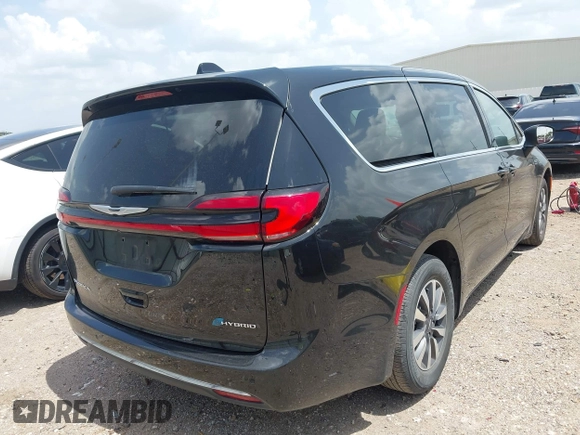 2023 Chrysler Pacifica Hybrid Touring L with VIN 2C4RC1L70PR622000, listed as a IAAI auction lot 42711826 with 65,109 mi miles and . Bid and sale history available at DreamBid. Image 4.