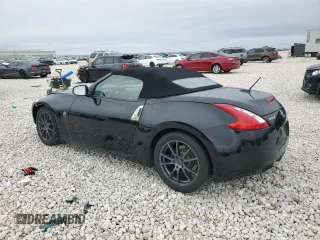 2014 Nissan 370Z Touring with VIN JN1AZ4FH1EM620177, listed as a Copart auction lot 42581255 with 106,957 mi miles and Salvage Title. Bid and sale history available at DreamBid. Image 2.