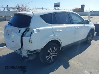 2017 Toyota RAV4 LE with VIN JTMZFREV8HJ145159, listed as a IAAI auction lot 42078884 with 103,425 mi miles and . Bid and sale history available at carsss.com. Image 4.