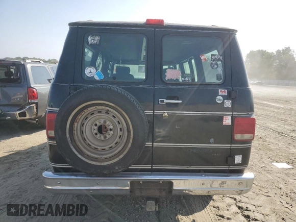 1994 Chevrolet Chevy Van z VIN 1GBEG25K3RF178166, wystawiony jako Copart lot #69173594 z przebiegiem 143 577 mil mil oraz Szkody całkowita. Historia ofert i sprzedaży dostępna na DreamBid. Obrazek 6.