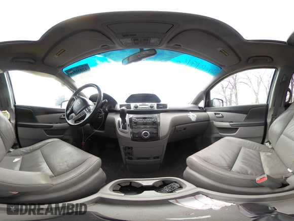 2012 Honda Odyssey Touring with VIN 5FNRL5H99CB028304, listed as a IAAI auction lot 42031916 with 216,185 mi miles and . Bid and sale history available at DreamBid. Image 19.