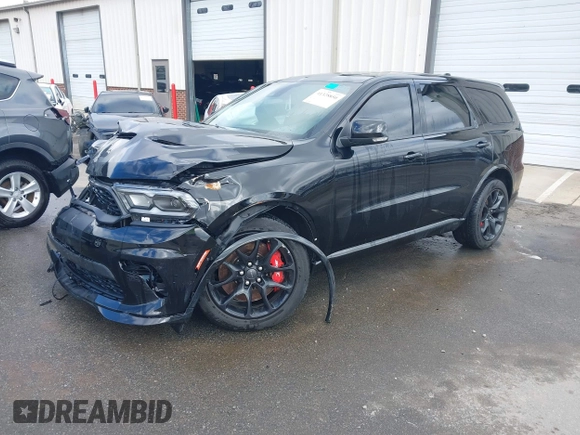 2023 Dodge Durango SRT Hellcat Premium with VIN 1C4SDJH90PC557375, listed as a IAAI auction lot 41328850 with 30,697 mi miles and . Bid and sale history available at DreamBid. Image 21.