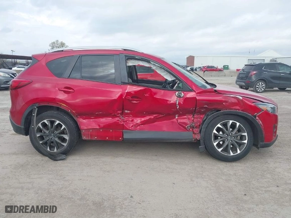 2016 Mazda CX-5 Grand Touring with VIN JM3KE4DYXG0641174, listed as a IAAI auction lot 41182655 with NaN miles. Bid and sale history available at carsss.com. Image 13.