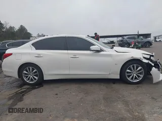2015 Infiniti Q50 Premium z VIN JN1BV7AP9FM331131, wystawiony jako IAAI lot #41786108 z przebiegiem 176 874 mil mil oraz . Historia ofert i sprzedaży dostępna na DreamBid. Obrazek 13.