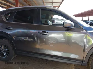2021 Mazda CX-5 Touring with VIN JM3KFACM2M1313750, listed as a IAAI auction lot 41762938 with 68,503 mi miles. Bid and sale history available at carsss.com. Image 13.