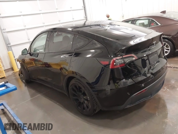 2021 Tesla Model Y Long Range with VIN 5YJYGAEE5MF305655, listed as a IAAI auction lot 41860993 with 50,750 mi miles. Bid and sale history available at carsss.com. Image 3.