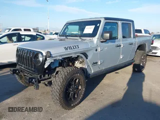2022 Jeep Gladiator Willys with VIN 1C6HJTAG4NL132558, listed as a IAAI auction lot 41626851 with 28,251 mi miles and . Bid and sale history available at DreamBid. Image 2.