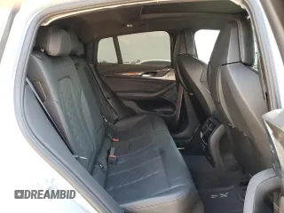 2022 BMW X4 M z VIN 5YM23EC02N9K87490, wystawiony jako Copart lot #65907114 z przebiegiem 55 555 mil mil oraz Szkoda całkowita • Salvage title. Historia ofert i sprzedaży dostępna na DreamBid. Obrazek 11.