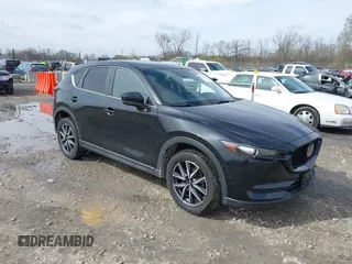 2018 Mazda CX-5 Touring with VIN JM3KFBCMXJ0438177, listed as a IAAI auction lot 42152275 with 65,434 mi miles and . Bid and sale history available at carsss.com. Image 1.