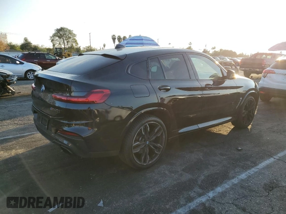 2020 BMW X4 M40i with VIN 5UX2V5C0XL9B53828, listed as a Copart auction lot 43190795 with 55,374 mi miles and Salvage title. Bid and sale history available at DreamBid. Image 3.