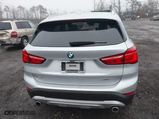 2021 BMW X1 xDrive28i with VIN WBXJG9C04M5T79810, listed as a IAAI auction lot 41471536 with 75,345 mi miles. Bid and sale history available at carsss.com. Image 16.