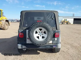 2005 Jeep Wrangler Sport with VIN 1J4FA49SX5P336380, listed as a IAAI auction lot 41752554 with 139,004 mi miles. Bid and sale history available at carsss.com. Image 16.