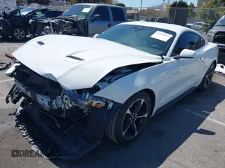 2021 Ford Mustang EcoBoost with VIN 1FA6P8TH4M5148415, listed as a IAAI auction lot 41945395 with 51,599 mi miles and . Bid and sale history available at DreamBid. Image 2.