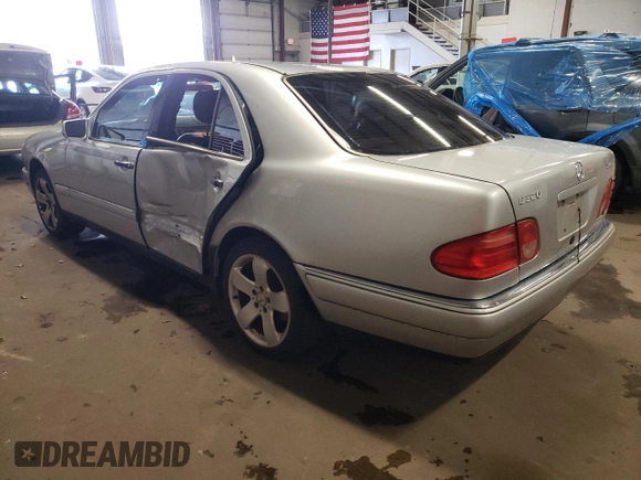 1999 Mercedes-Benz E-Class with VIN WDBJF82H4XX021888, listed as a Copart auction lot 83069274 with 173,198 mi miles and Salvage Title. Bid and sale history available at carsss.com. Image 2.