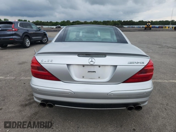 2005 Mercedes-Benz SL 500 with VIN WDBSK75F65F093215, listed as a Copart auction lot 63744135 with 94,645 mi miles and Salvage title. Bid and sale history available at DreamBid. Image 6.