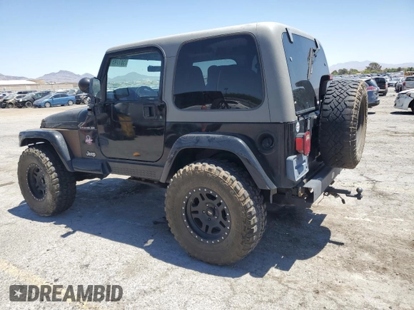1999 Jeep Wrangler Sahara with VIN 1J4FY49S8XP472733, listed as a Copart auction lot 58174915 with 170,838 mi miles and Salvage title. Bid and sale history available at DreamBid. Image 2.