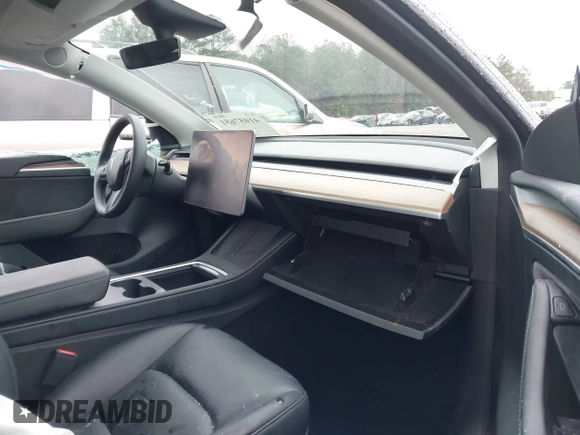 2023 Tesla Model Y Long Range with VIN 7SAYGDEE7PF673988, listed as a IAAI auction lot 41057651 with 29,683 mi miles and . Bid and sale history available at DreamBid. Image 5.