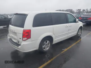 2012 Dodge Grand Caravan SXT with VIN 2C4RDGCG4CR304472, listed as a IAAI auction lot 41396437 with 180,309 mi miles and . Bid and sale history available at DreamBid. Image 4.