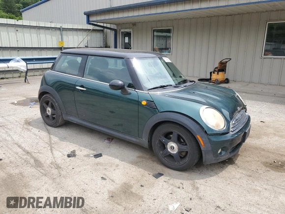 2007 MINI Hardtop with VIN WMWMF33537TL77985, listed as a Copart auction lot 61908635 with 180,470 mi miles and Salvage title. Bid and sale history available at DreamBid. Image 4.