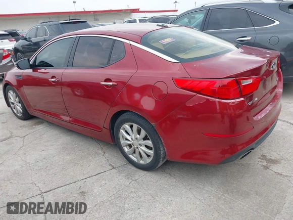 2014 Kia Optima EX z VIN 5XXGN4A71EG284280, wystawiony jako IAAI lot #42278795 z przebiegiem 179 200 mil mil oraz . Historia ofert i sprzedaży dostępna na DreamBid. Obrazek 3.