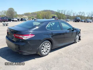2020 Toyota Camry LE with VIN 4T1C11AK9LU387012, listed as a IAAI auction lot 42103647 with 64,049 mi miles and . Bid and sale history available at carsss.com. Image 4.