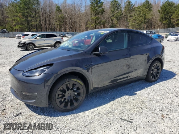 2025 Tesla Model Y Long Range with VIN 7SAYGAEEXSF253326, listed as a Copart auction lot 49527965 with 5,803 mi miles and Salvage Title. Bid and sale history available at DreamBid. Image 1.